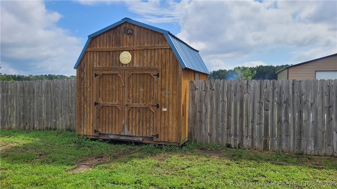 1235 Martin Road St. Pauls, NC 28384 - Photo 22 of 28 a view of a small house
