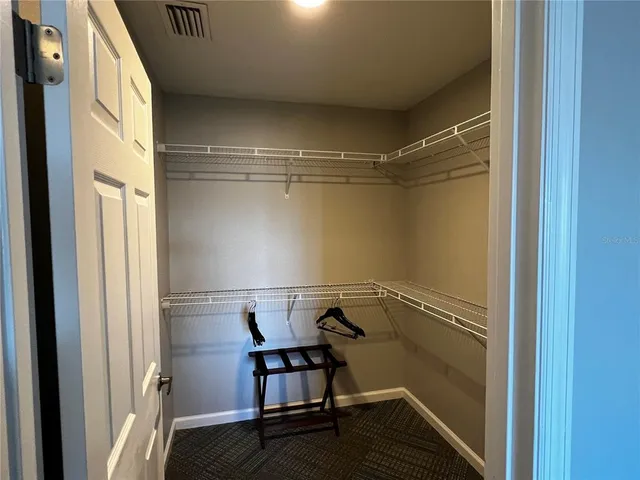 a view of storage and utility room with washer and dryer