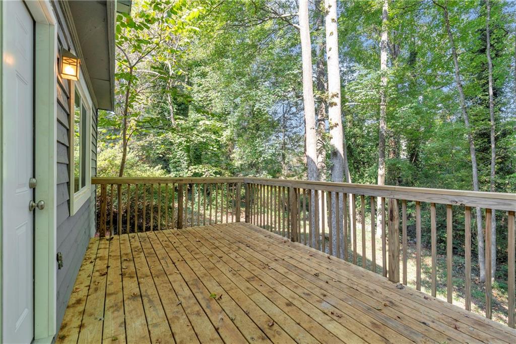 4907 Habersham Ridge Southwest Lilburn, GA 30047 - Photo 32 of 76 a view of balcony with wooden floor