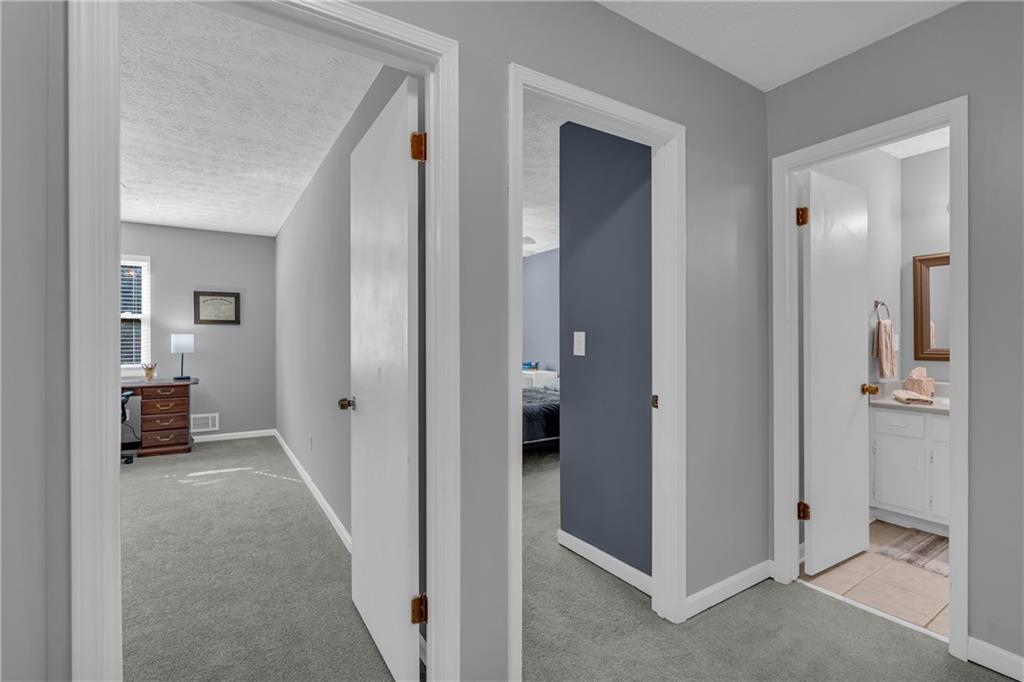 4907 Habersham Ridge Southwest Lilburn, GA 30047 - Photo 33 of 76 a view of a bedroom from the hallway