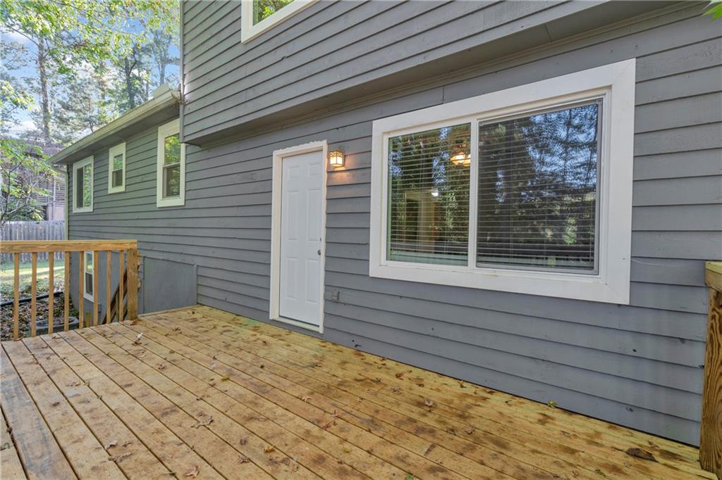 4907 Habersham Ridge Southwest Lilburn, GA 30047 - Photo 35 of 76 a view of house with backyard and sitting area