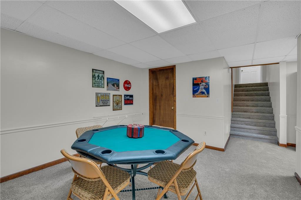 4907 Habersham Ridge Southwest Lilburn, GA 30047 - Photo 53 of 76 a room with furniture and wooden floor