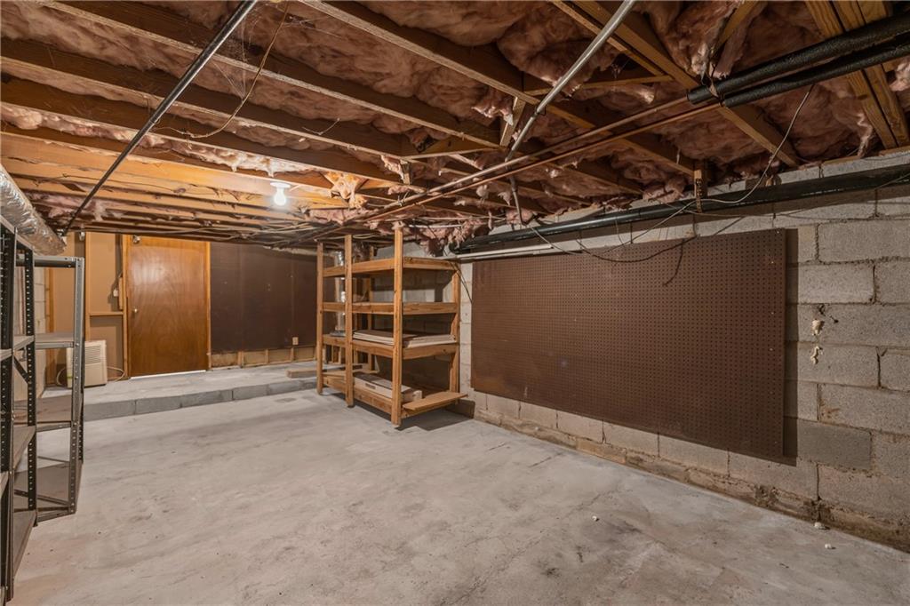 4907 Habersham Ridge Southwest Lilburn, GA 30047 - Photo 60 of 76 a view of an empty room with wooden walls