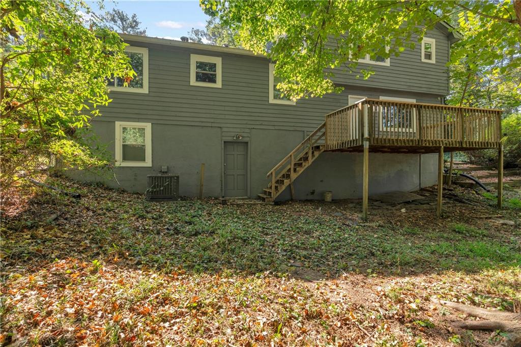 4907 Habersham Ridge Southwest Lilburn, GA 30047 - Photo 65 of 76 a view of a house with a yard and sitting area