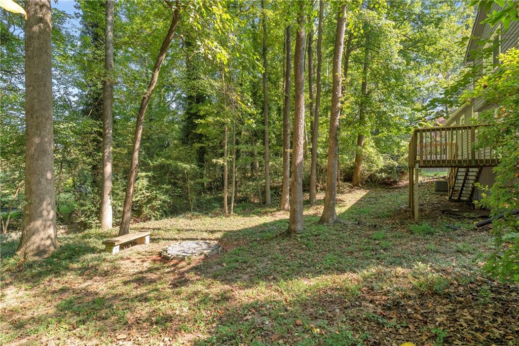 4907 Habersham Ridge Southwest Lilburn, GA 30047 - Photo 67 of 76 a view of outdoor space with trees