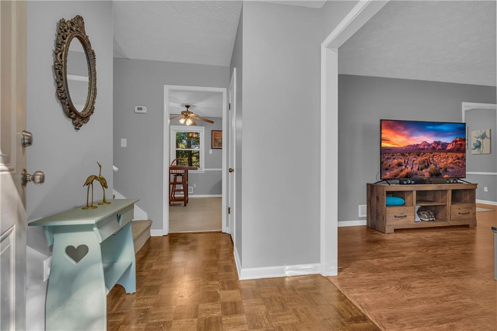 4907 Habersham Ridge Southwest Lilburn, GA 30047 - Photo 7 of 76 a living room with furniture and a flat screen tv