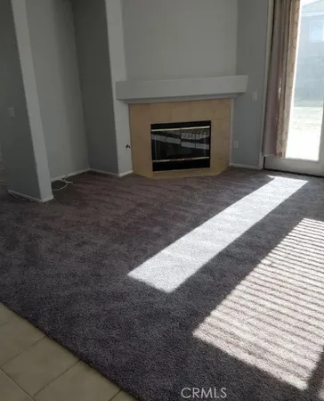 a view of a livingroom with a fireplace