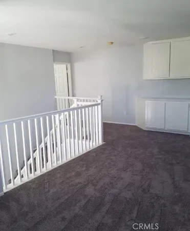 a view of a hallway with entryway