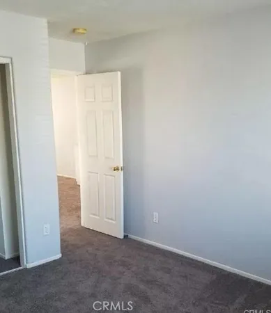 an empty room with closet area