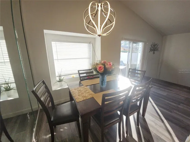 a view of a dining room with furniture window and outside view