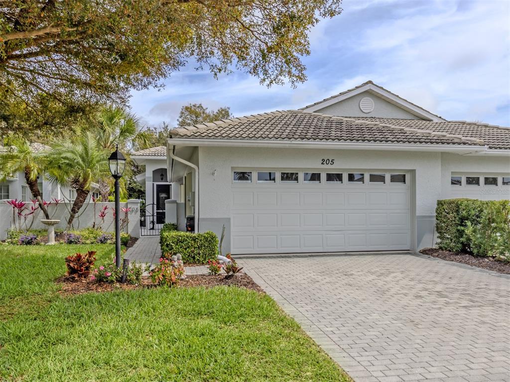 205 Reclinata Circle Venice, FL 34292 - Photo 2 of 62 front view of a house with a yard