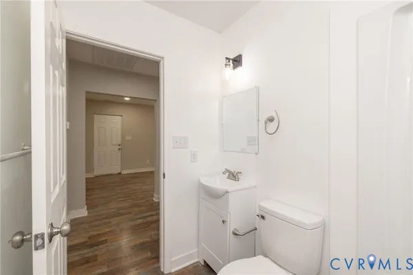 a bathroom with a toilet a sink and shower