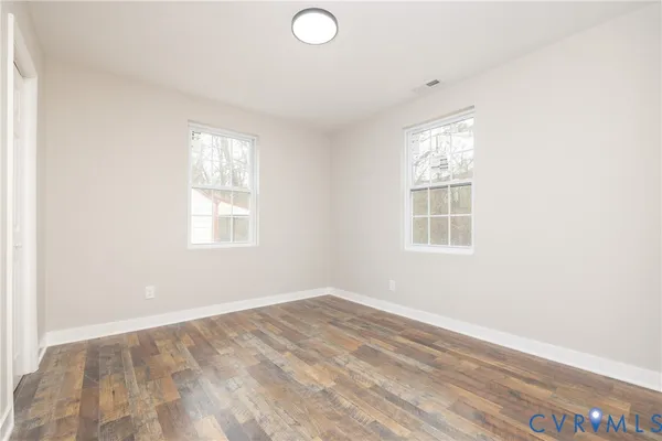 an empty room with windows