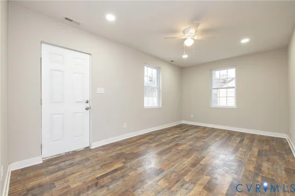 a view of an empty room with a window