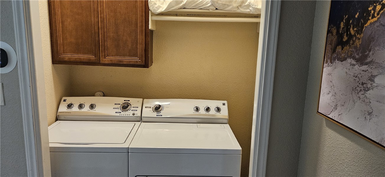 14334 Cruiser Street, Unit 202A Corpus Christi, TX 78418 - Photo 13 of 38 a close up view of washer and dryer