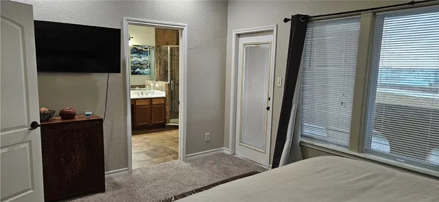 a view of a hallway and a livingroom with wooden floor