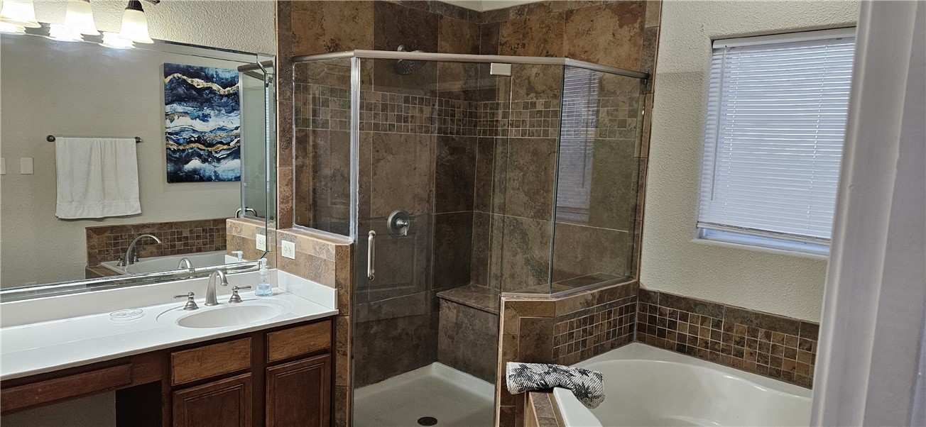 14334 Cruiser Street, Unit 202A Corpus Christi, TX 78418 - Photo 16 of 38 a bathroom with a sink and a mirror