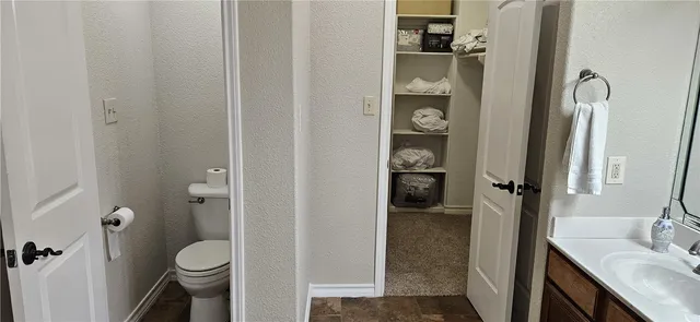 a bathroom with a sink and toilet