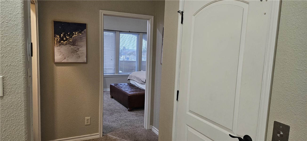 14334 Cruiser Street, Unit 202A Corpus Christi, TX 78418 - Photo 25 of 38 a view of a hallway and a livingroom and a dining room