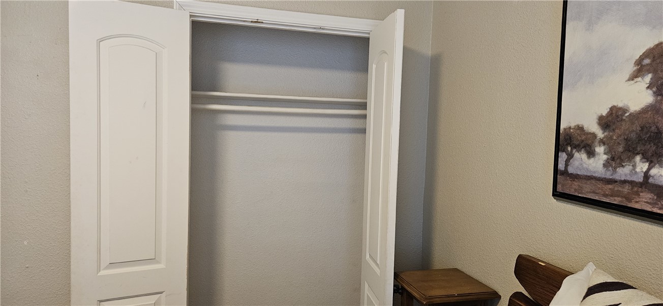 14334 Cruiser Street, Unit 202A Corpus Christi, TX 78418 - Photo 28 of 38 a room with a bed and furniture