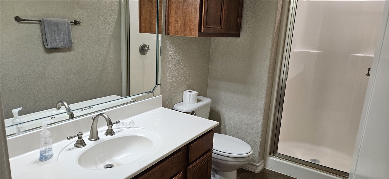 14334 Cruiser Street, Unit 202A Corpus Christi, TX 78418 - Photo 30 of 38 a bathroom with a sink toilet and shower