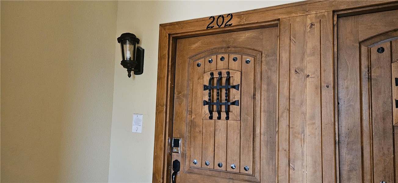 14334 Cruiser Street, Unit 202A Corpus Christi, TX 78418 - Photo 3 of 38 a front view of a house with a door