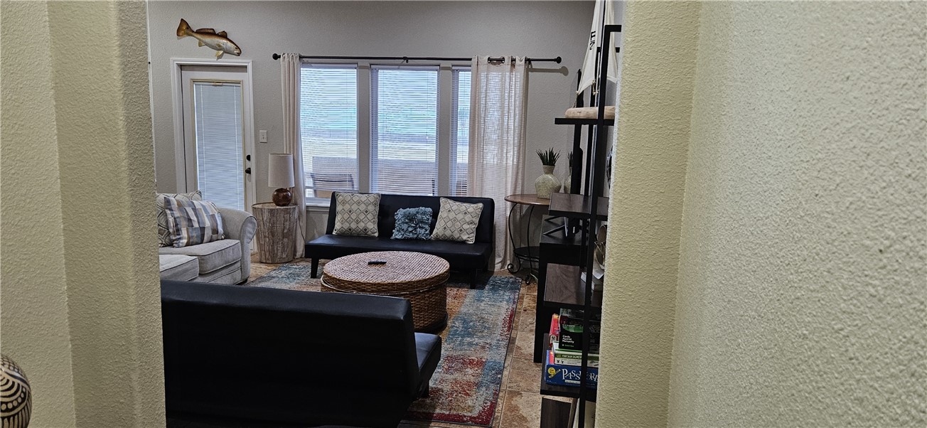 14334 Cruiser Street, Unit 202A Corpus Christi, TX 78418 - Photo 4 of 38 a bathroom with a sink and a mirror