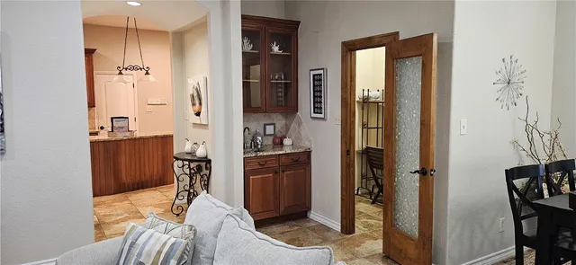 a bathroom with a tub shower and sink