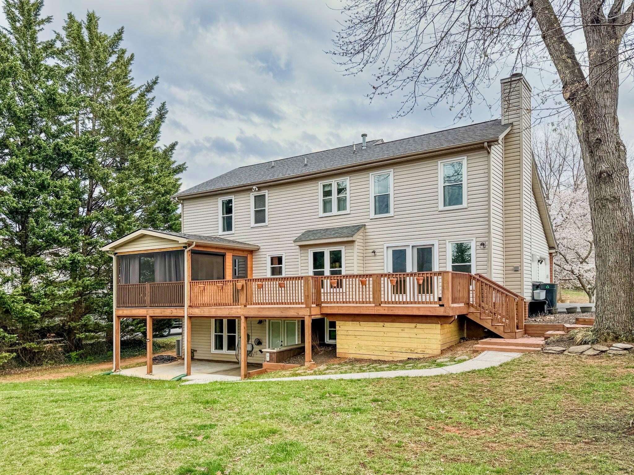 282 Apple Lane Roanoke, VA 24019 - Photo 2 of 2 a front view of a house with a yard table and chairs