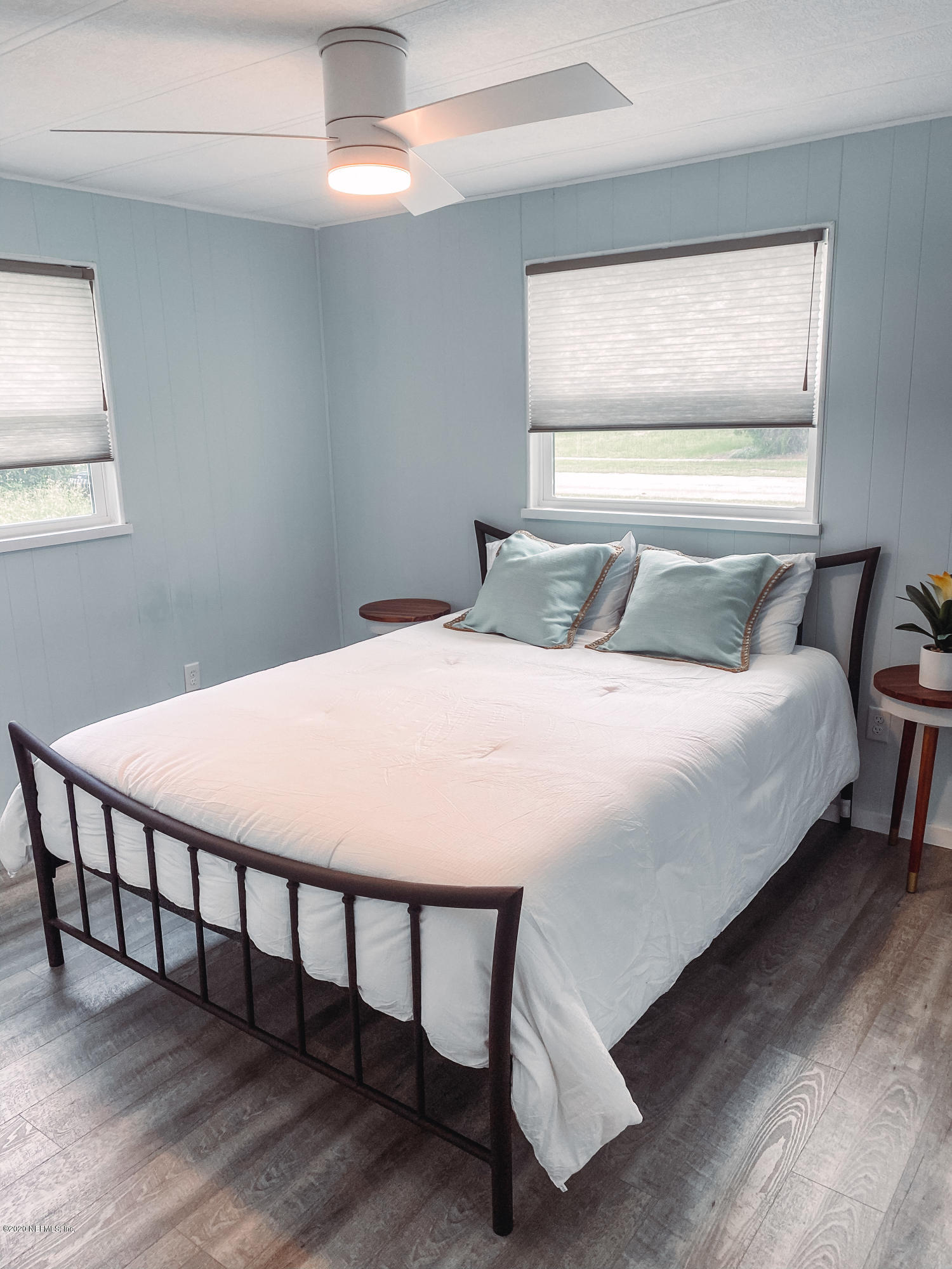920 Palermo Road St. Augustine, FL 32086 - Photo 8 of 15 a bed sitting in a bedroom next to a window