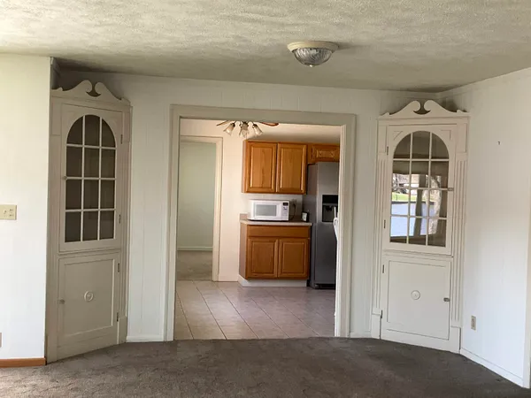 a kitchen with stainless steel appliances granite countertop a refrigerator a sink dishwasher stove and refrigerator