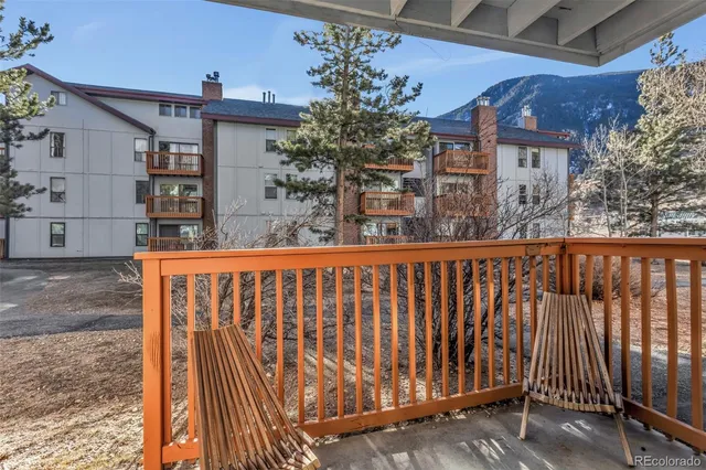 a view of balcony with wooden floor