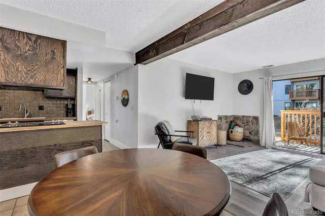 a spacious bedroom with a bed and a large window