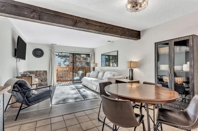 a dining room with furniture and window