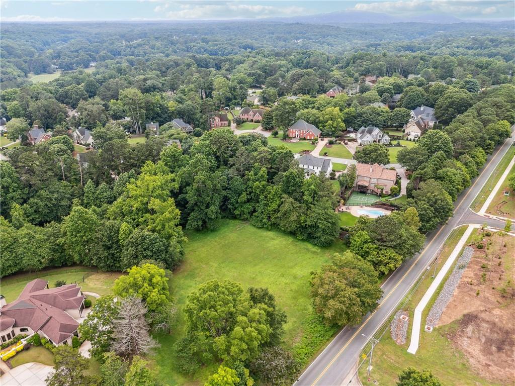 0 Cox Road Roswell, GA 30075 - Photo 6 of 11 an aerial view of residential houses with outdoor space and trees