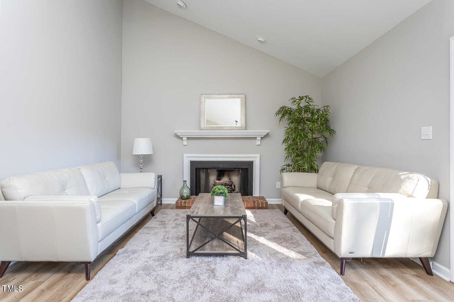 3008 Rue Sans Famille Raleigh, NC 27607 - Photo 2 of 21 a living room with furniture and a fireplace