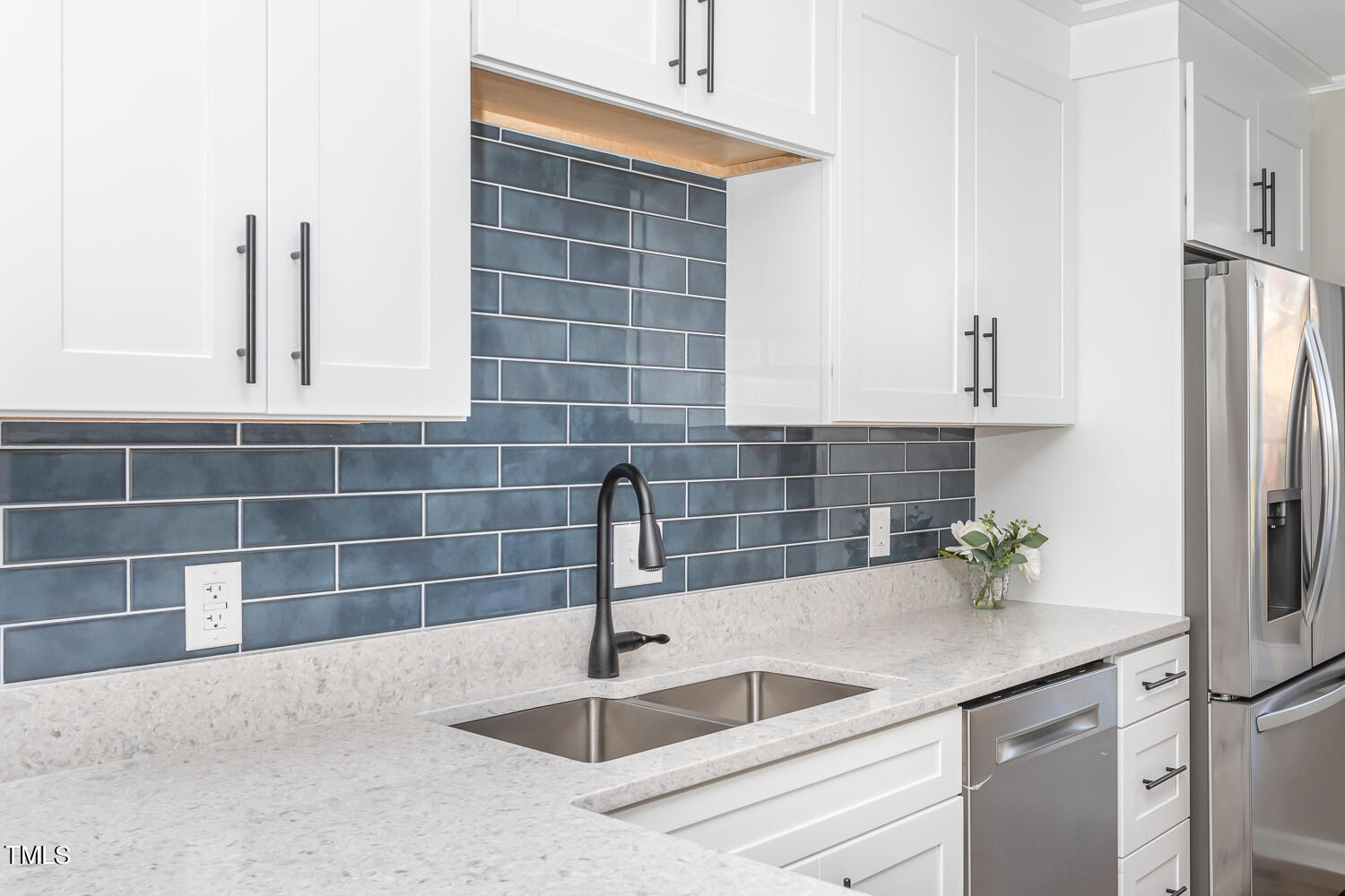 3008 Rue Sans Famille Raleigh, NC 27607 - Photo 7 of 21 a kitchen with a sink and a refrigerator
