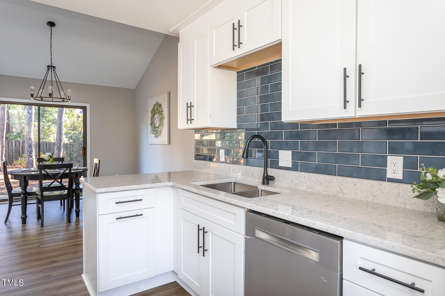 3008 Rue Sans Famille Raleigh, NC 27607 - Photo 9 of 21 a kitchen with a sink cabinets and window