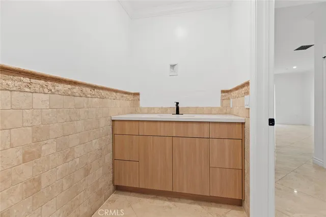 a view of an empty room and wooden floor