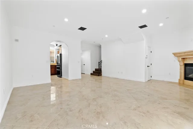 a kitchen with stainless steel appliances granite countertop a stove top oven a sink and dishwasher