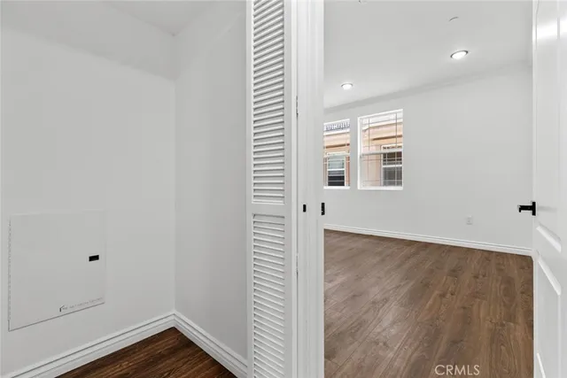 a view of walk in closet with empty racks