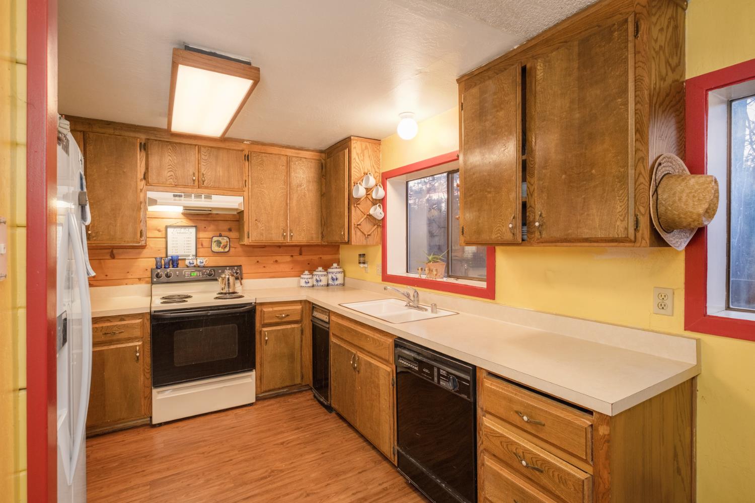 34065 Shaver Springs Road Auberry, CA 93602 - Photo 10 of 13 a kitchen with stainless steel appliances granite countertop a sink a stove and a refrigerator