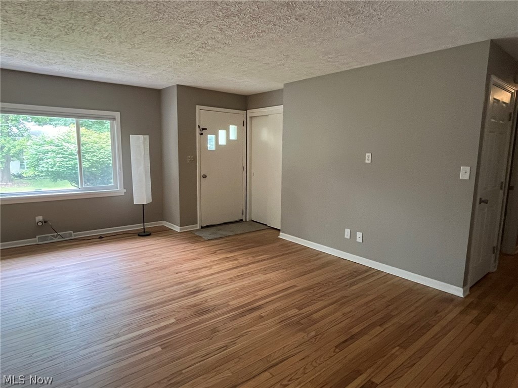 1166 Hampton Road Kent, OH 44240 - Photo 2 of 26 Living room with large picture window and recently refinished hardwood floors
