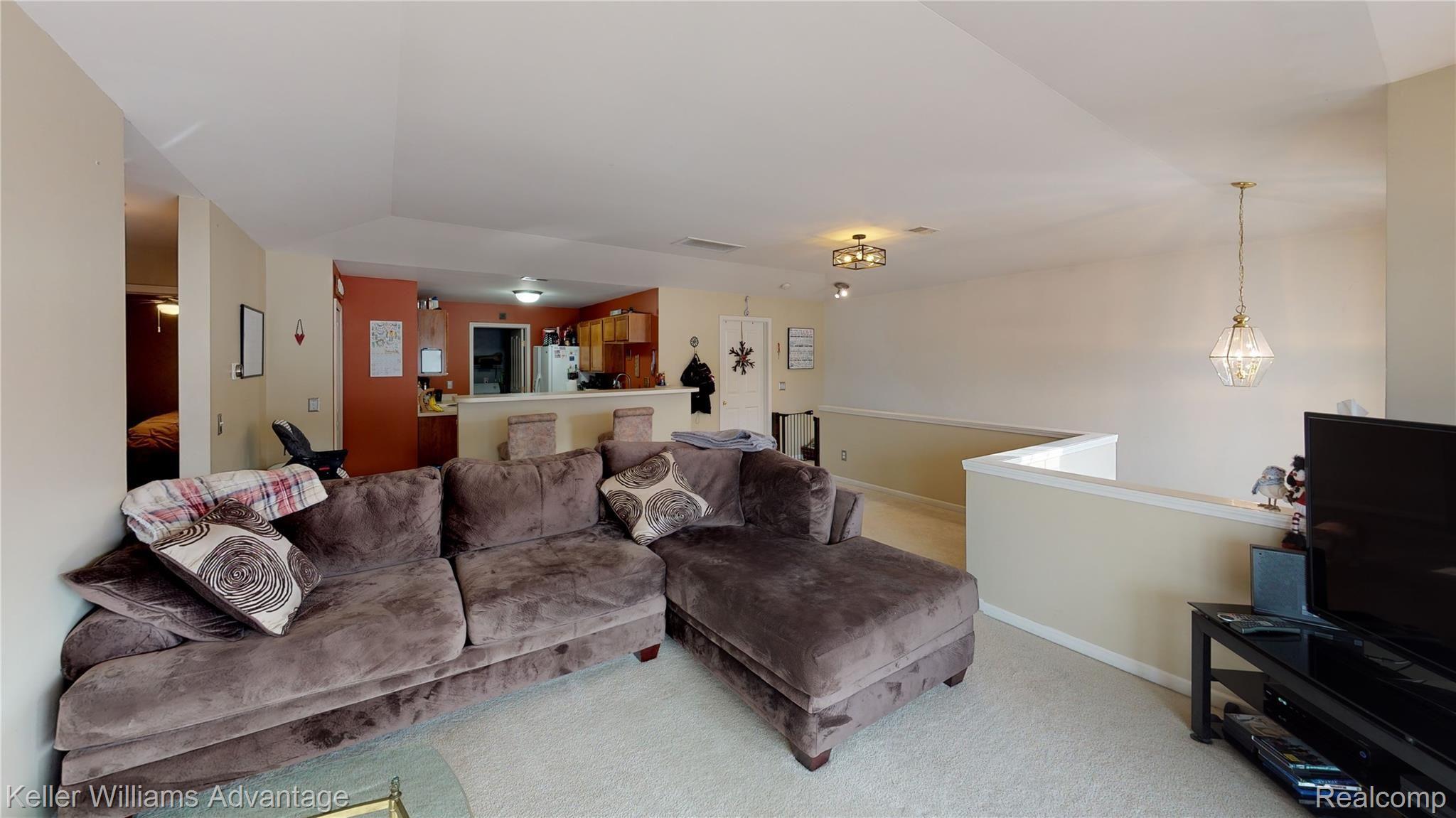 4057 Hampton Ridge Boulevard Howell, MI 48843 - Photo 23 of 25 4057-Hampton-Ridge-Blvd-Living-Room.jpg