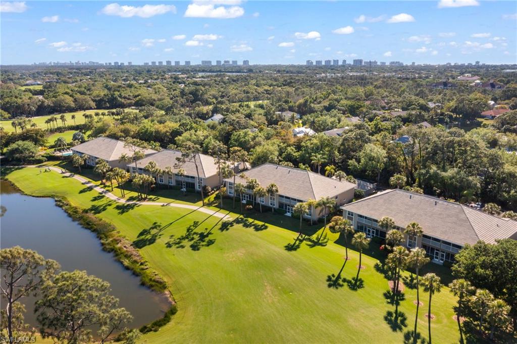 1940 Willow Bend Circle, Unit 103 Naples, FL 34109 - Photo 3 of 3 an aerial view of residential houses with outdoor space