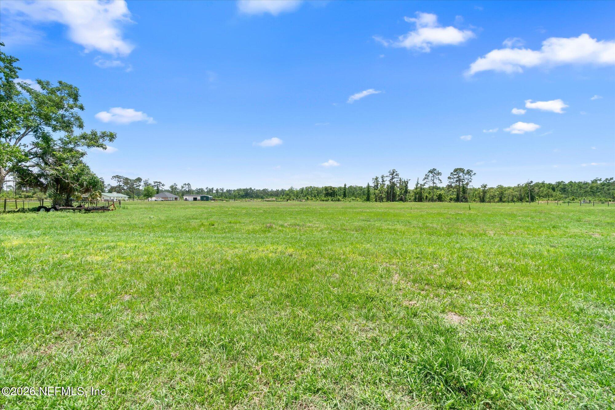 786 West River Road Palatka, FL 32177 - Photo 31 of 53 a view of a field with an trees in the background