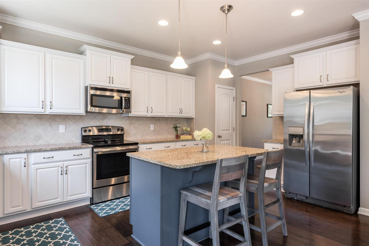 107 Holyoke Court Raleigh, NC 27603 - Photo 7 of 25 Plenty of counter space. Granite and stainless steel appliances. Kitchen