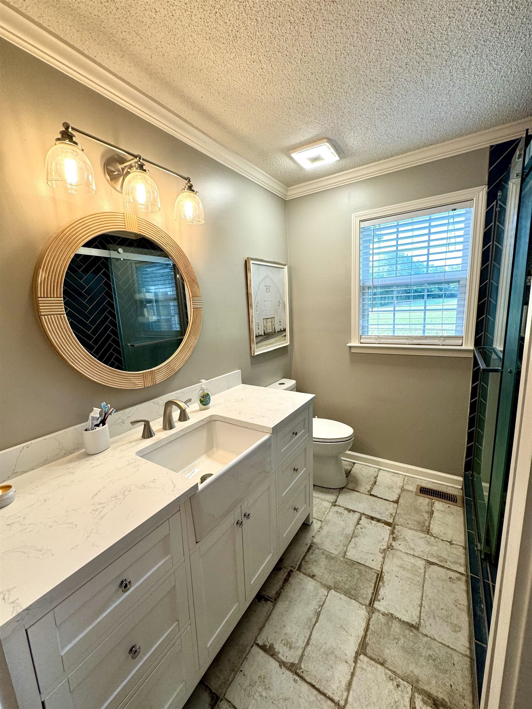 3312 Old Memphis Road Covington, TN 38019 - Photo 23 of 32 Bathroom with vanity, a textured ceiling, toilet, and ornamental molding