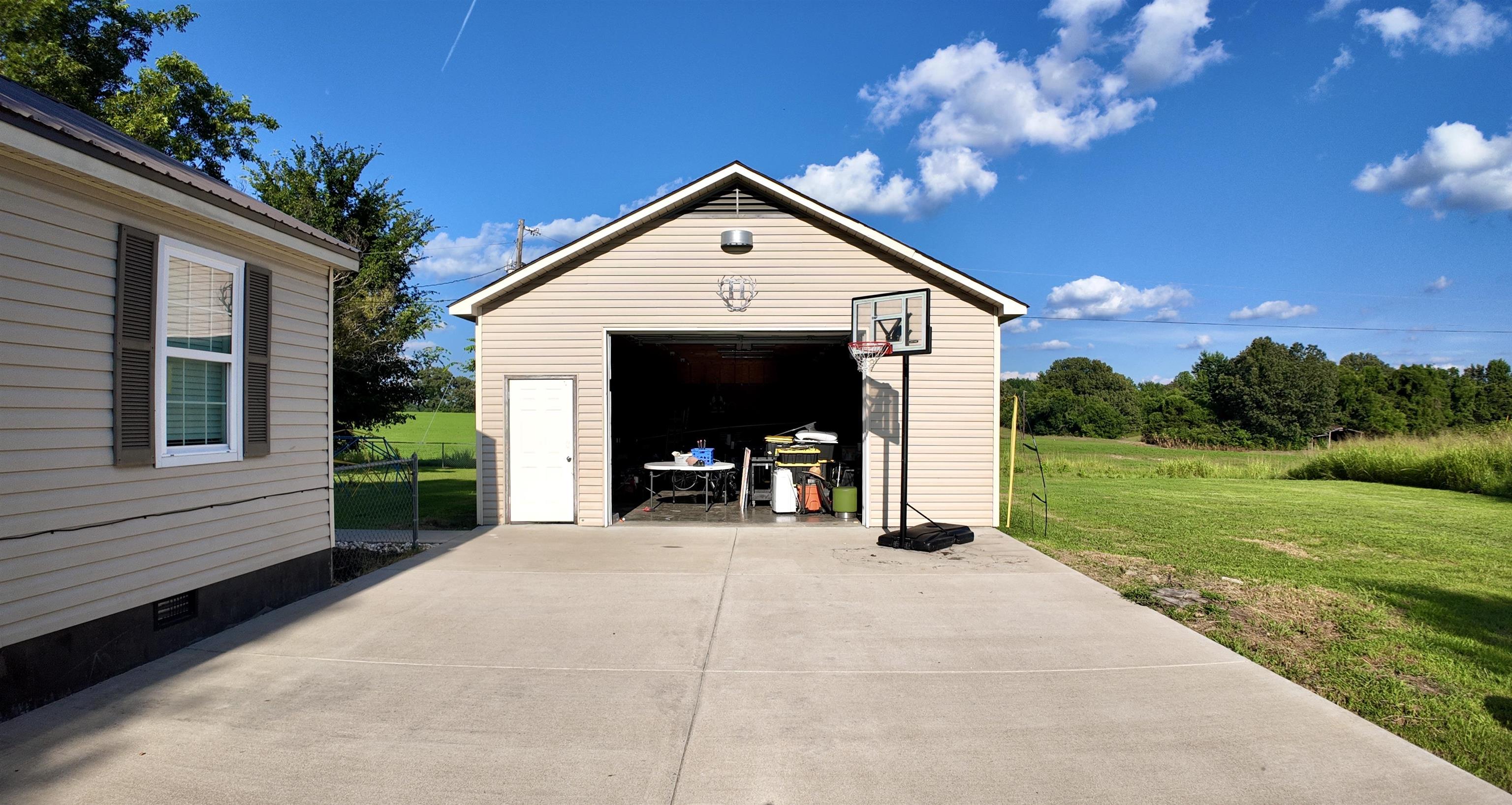 3312 Old Memphis Road Covington, TN 38019 - Photo 30 of 32 Garage with a lawn