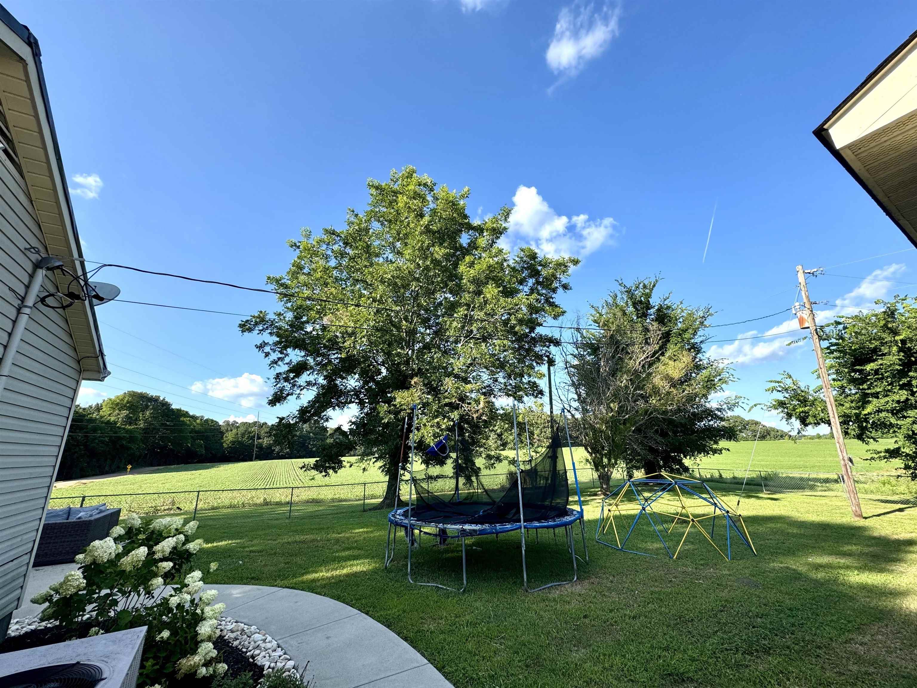 3312 Old Memphis Road Covington, TN 38019 - Photo 32 of 32 View of yard with a trampoline